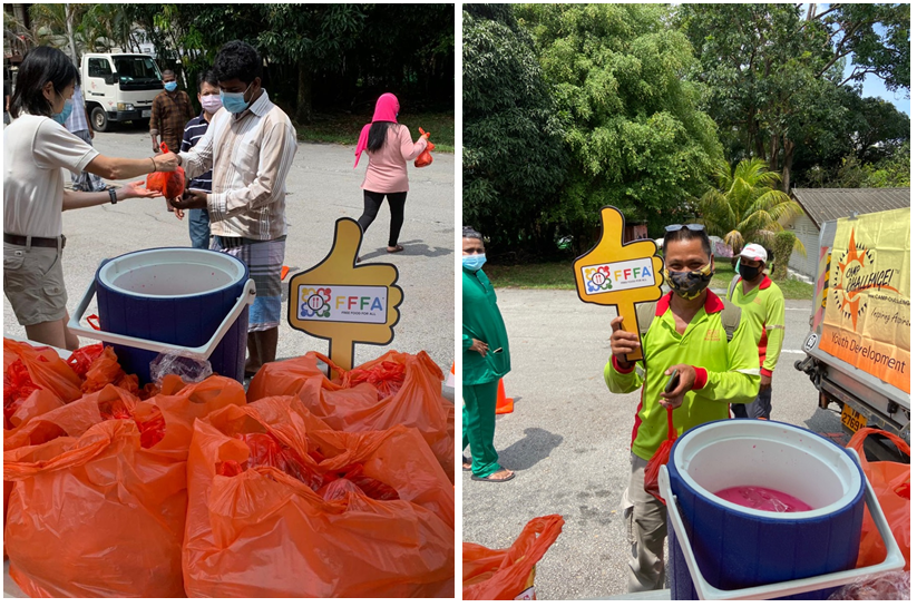 Giving out lunch for Hari Raya