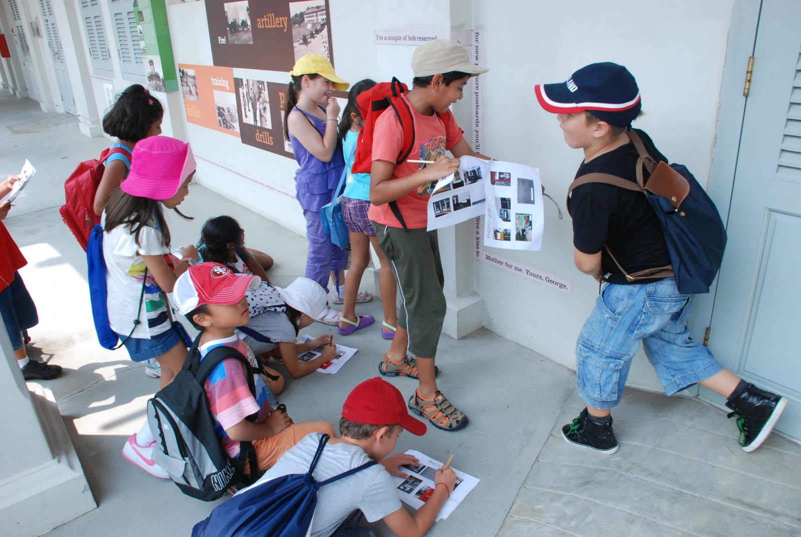 Children solving a treasure hunt challenge together at a CAMP CHALLENGE holiday camp