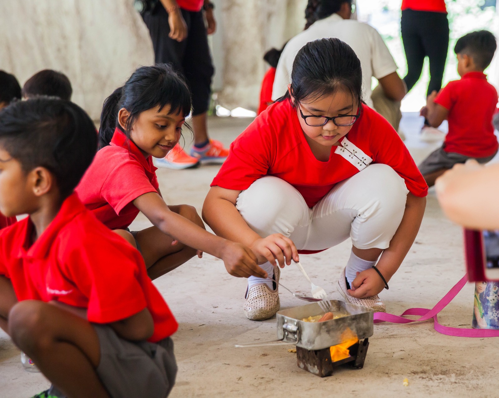 Kids building a DIY project during a team challenge at holiday camp